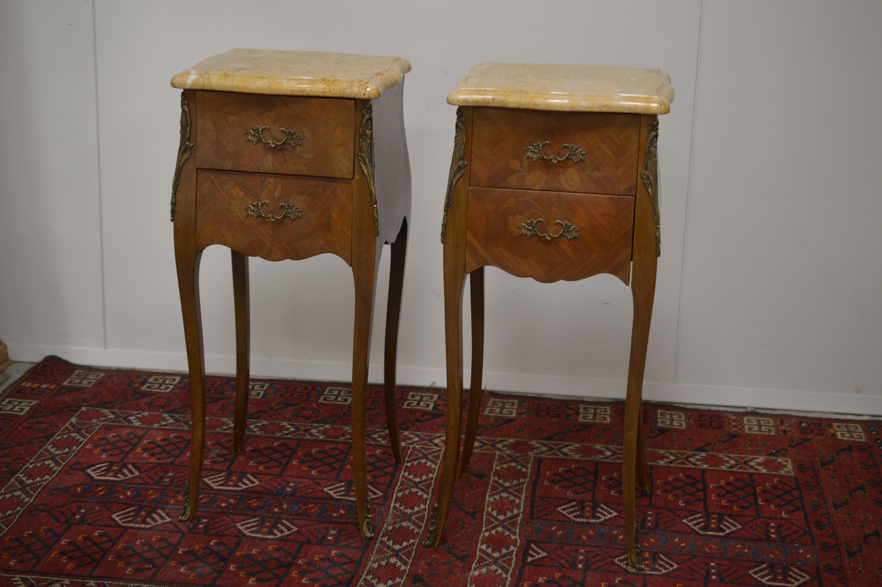 Lot 120 - A pair of 20th Century French Louis XV style kingwood nightstands or bedside drawers