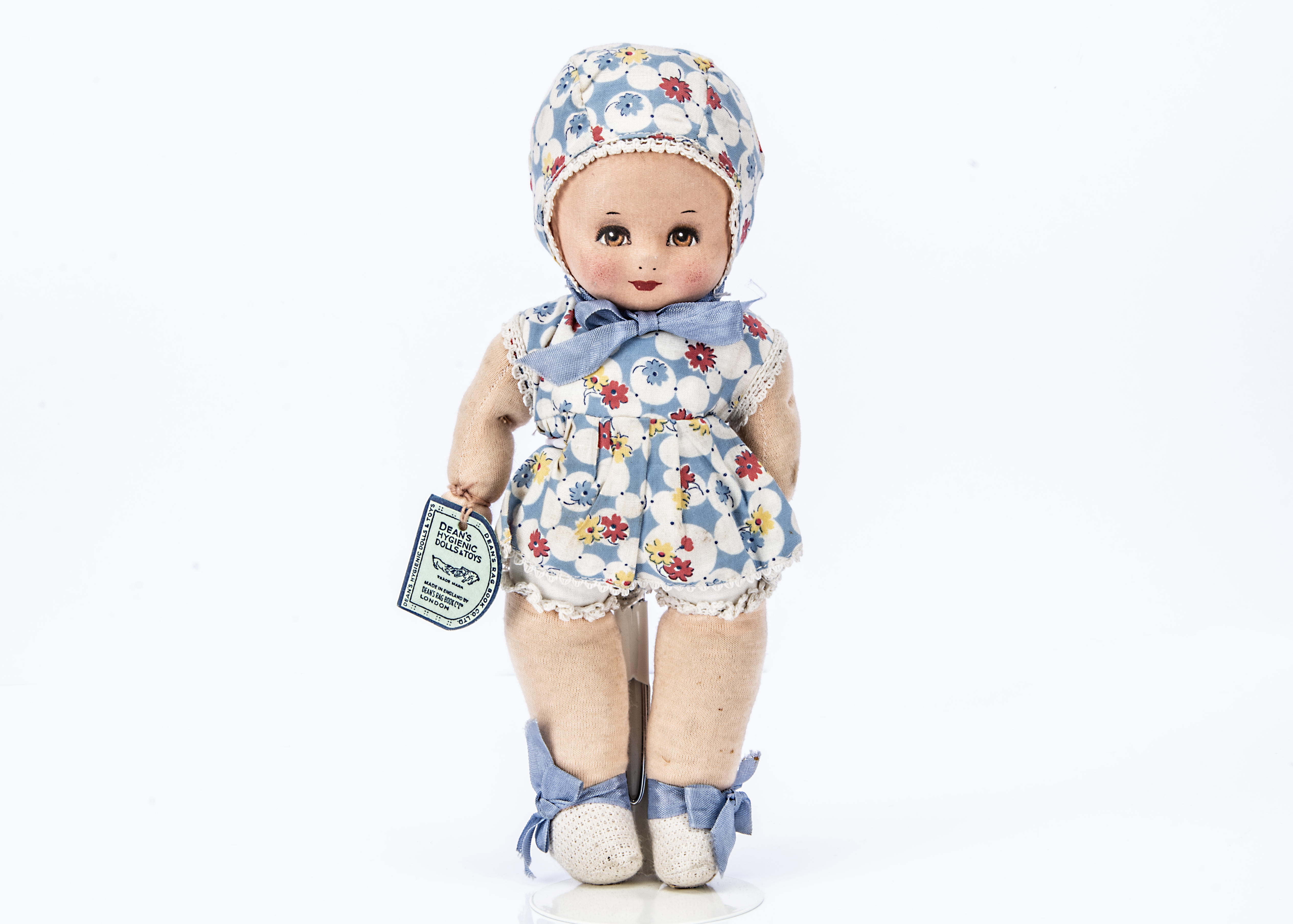 A Dean's Rag Book Co Baby Doll with card tag, from a Collection of Dean's Rag Book Co Dolls and Toys