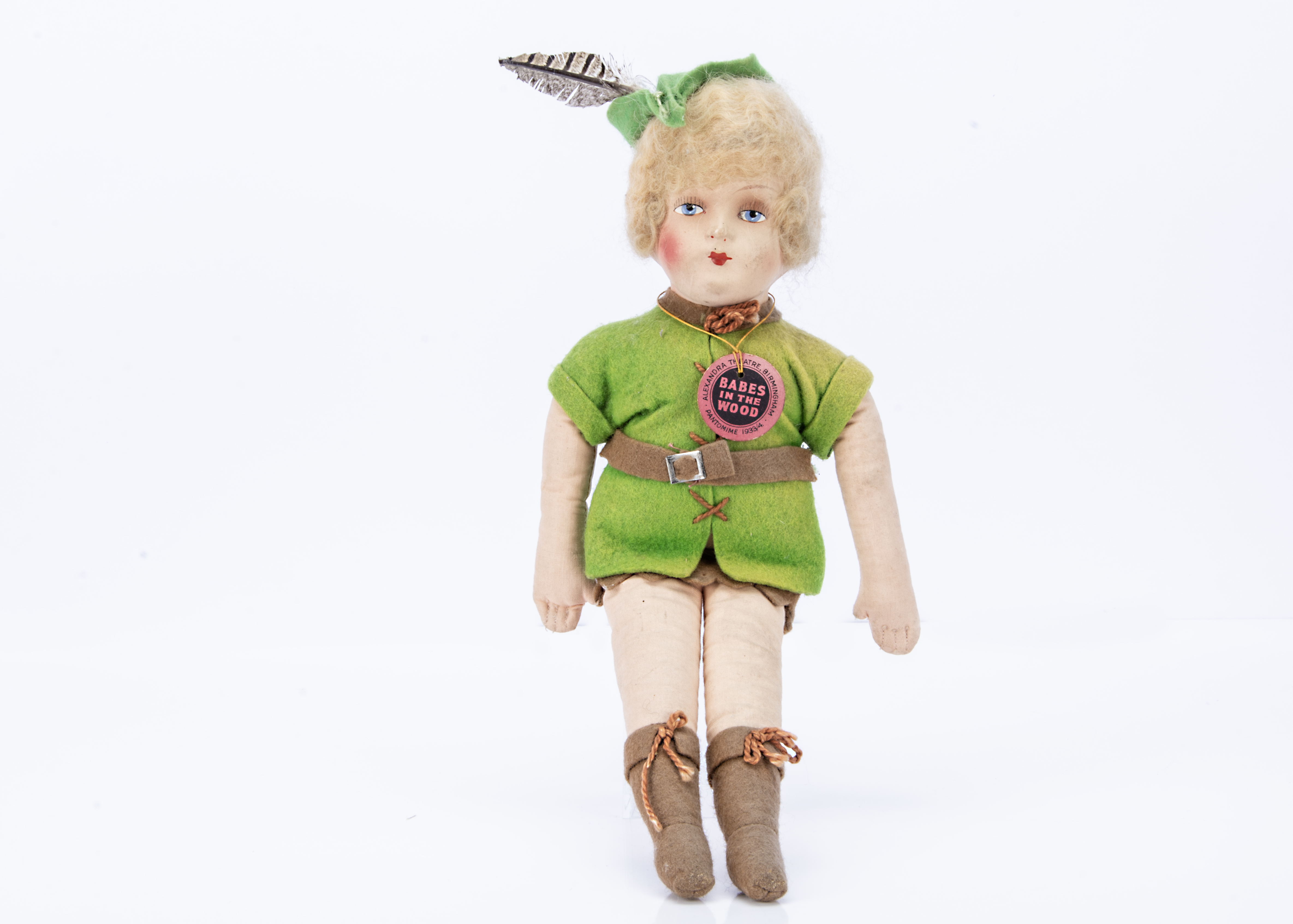 A Robin Hood from Babes in the Woods with card tag, from a collection of pantomime toys and dolls